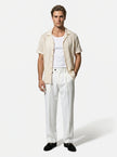 Man wearing FJØRNA straight fit tailored men's trousers, classic and versatile for everyday wear.