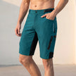 Men's Marine Blue FJØRNA outdoor performance shorts with zippered pockets, designed for comfort and active outdoor wear.
