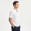 Men's linen short sleeve Henley T-shirt by FJØRNA, showcasing lightweight fabric and classic design in a casual fit.