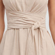 Elegant women's summer maxi dress by FJØRNA featuring a twist waist and sleeveless design for a stylish warm-weather look.