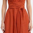 Elegant women's summer maxi dress by FJØRNA featuring a twist waist and sleeveless design, perfect for warm-weather occasions.