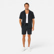 Men's lightweight summer set by FJØRNA featuring a textured shirt and matching shorts for casual warm-weather wear.