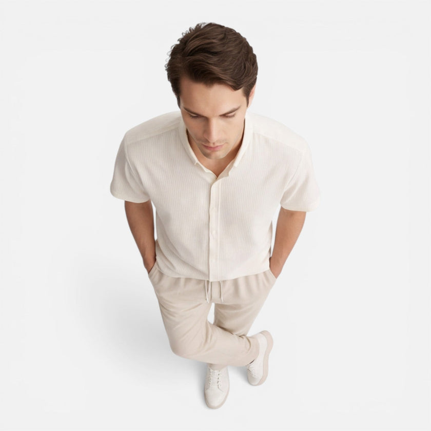 Men's casual 2-piece set by FJØRNA featuring a short sleeve shirt and matching pants, styled for relaxed everyday wear.