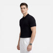 Men's ribbed knit polo shirt by FJØRNA, premium cotton, slim fit, showcasing the textured ribbed design and classic collar.