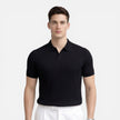 Men's ribbed knit polo shirt by FJØRNA, premium cotton, slim fit, featuring a classic collar and ribbed texture.
