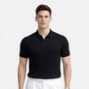 Men's ribbed knit polo shirt by FJØRNA, premium cotton, slim fit, featuring a classic collar and ribbed texture.