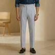 Men's light blue high waist tailored straight leg trousers by FJØRNA, showcasing a sleek, modern fit and crisp fabric.