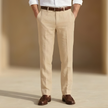 Men's linen straight leg trousers by FJØRNA featuring pleats, tailored for a smart, casual look.