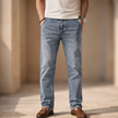 Men's lightweight casual straight leg jeans by FJØRNA, showing a relaxed fit with classic denim details and a casual style.