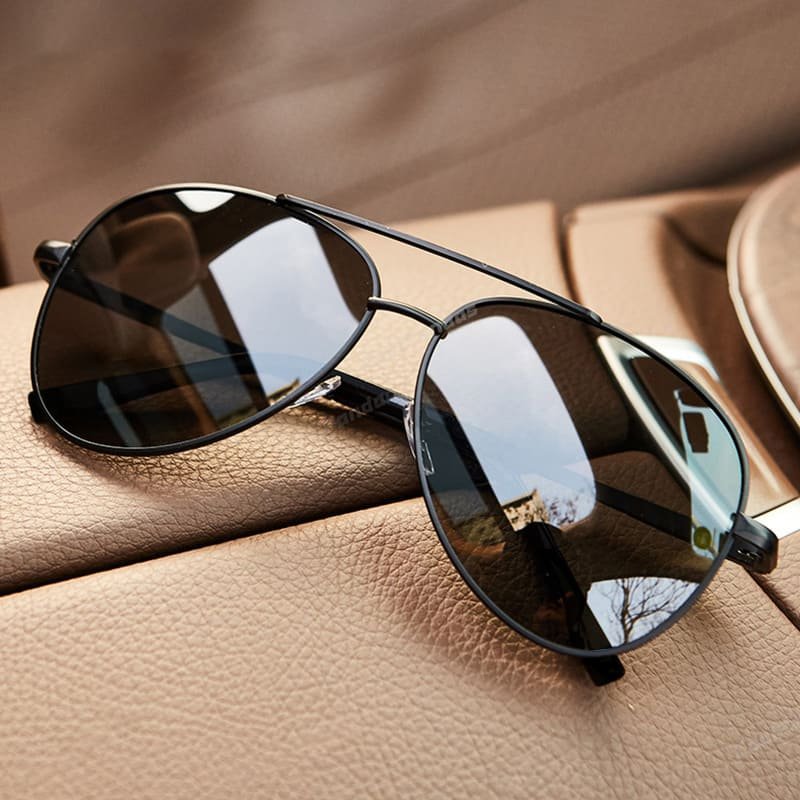 Men's aviator sunglasses with metal double bridge frame by FJØRNA, featuring classic aviator design and tinted lenses.