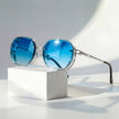 Men's geometric sunglasses with metal frame and gradient lenses by FJØRNA, showcasing stylish eyewear with modern design.