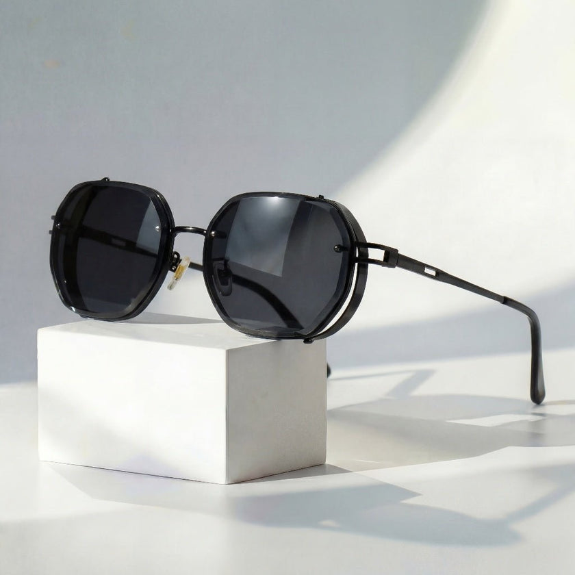 Men's geometric sunglasses with metal frame and gradient lenses by FJØRNA, showcasing stylish design and modern eyewear features.