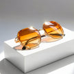 Men's geometric sunglasses with metal frame and gradient lenses by FJØRNA, showcasing stylish eyewear design.