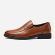 Brown men's leather slip-on business loafers by FJØRNA, side profile view showcasing sleek design and smooth leather finish.