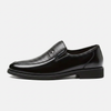 Side profile of men's leather slip-on business loafers by FJØRNA, showcasing sleek design and smooth leather finish.