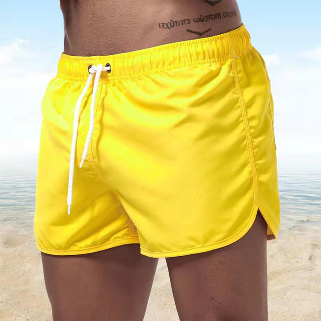 Men's FJØRNA relaxed fit swim shorts with elastic waist and quick-dry fabric, perfect for beach and poolside comfort.