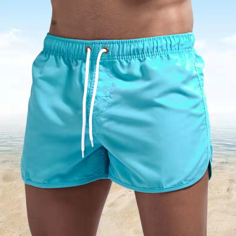 Men's FJØRNA relaxed fit swim shorts with quick-dry fabric and elastic waistband, designed for comfortable beachwear.
