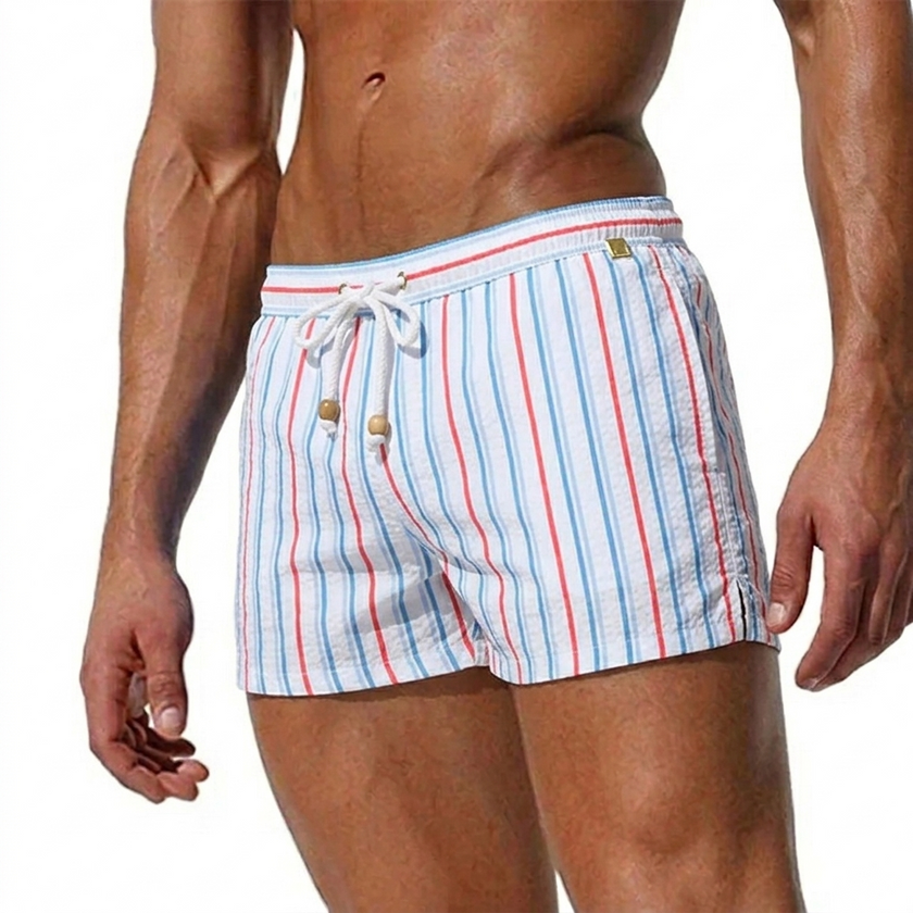 Men's striped swim shorts by FJØRNA with drawstring waist and quick-dry fabric, suitable for beach or pool activities.