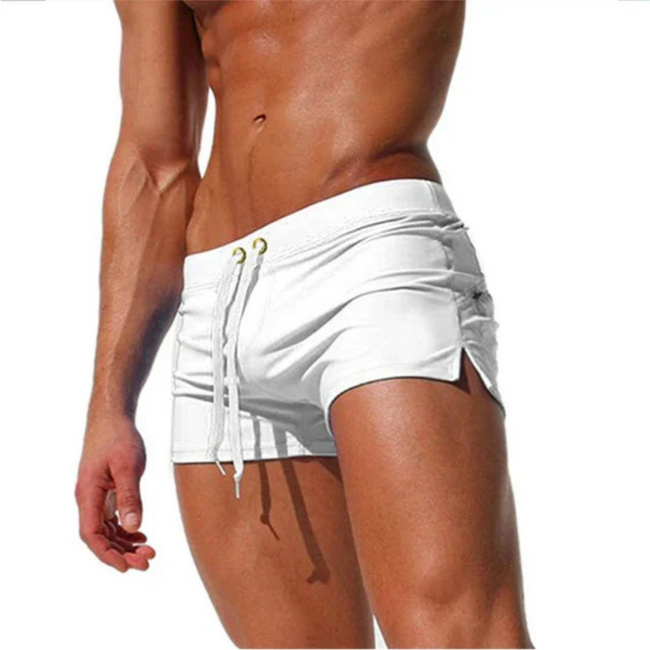 FJØRNA men's swim boxers with adjustable waistband and side split, featuring lightweight fabric and relaxed fit for beachwear.