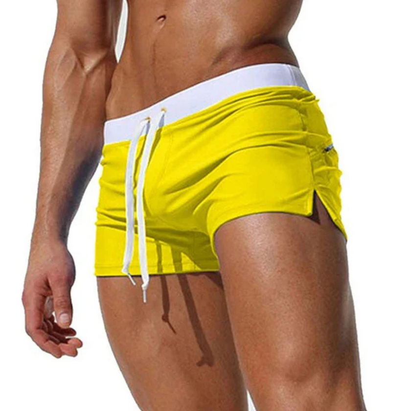 Men's FJØRNA swim boxers with adjustable waistband and side split, featuring quick-drying fabric and comfortable fit.