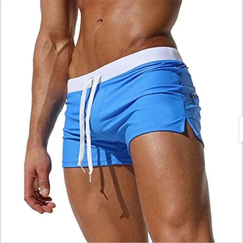 Men's FJØRNA swim boxers with adjustable waistband and side split, designed for comfort and style in the water.