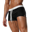 Men's FJØRNA swim boxers with adjustable waistband and side split, featuring lightweight, quick-drying fabric for comfortable swimming.