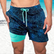 Men's FJØRNA swim shorts with colorful multi-print design and built-in compression liner, ideal for swimming and active wear.