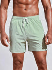 Men's pinstripe swim shorts with drawstring waist by FJØRNA, featuring a stylish pattern and comfortable fit for swimming or beach wear.