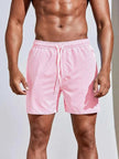 Men's FJØRNA pinstripe swim shorts with drawstring waist, featuring a stylish striped pattern and comfortable fit.