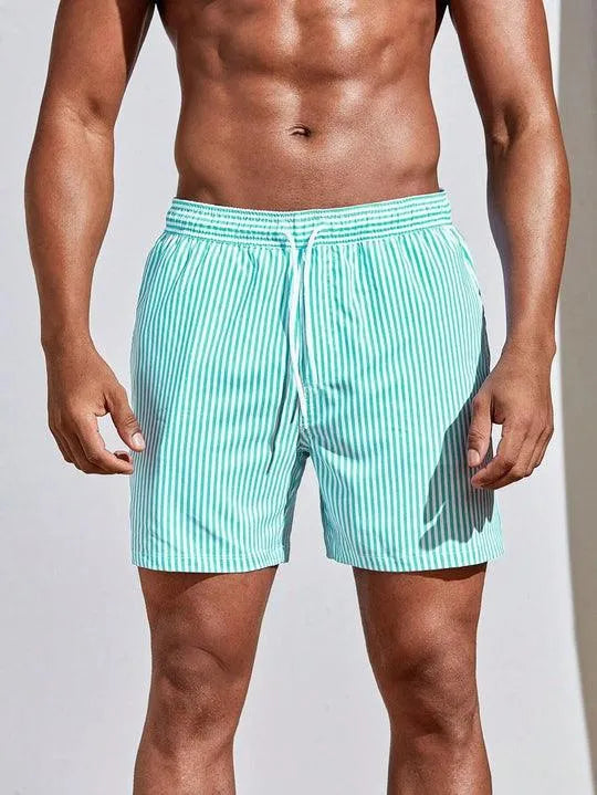 Men's FJØRNA pinstripe swim shorts with a drawstring waist, featuring a stylish striped pattern and comfortable fit.
