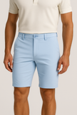 Light blue FJØRNA men's Bermuda shorts with a relaxed fit, suitable for casual summer wear.