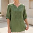 FJØRNA women's summer floral V-neck linen blouse in military green, flowy and lightweight for warm weather.