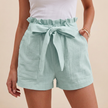 Mint green women's linen summer shorts with high waist and pockets, stylish and comfortable for warm weather.