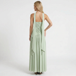 Mint green women's strapless maxi dress by FJØRNA, back view showing flowing fabric and elegant design for formal occasions.