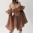 Mocha brown FJØRNA mini dress with a fitted silhouette, styled with streetwear and Y2K-inspired fashion details.
