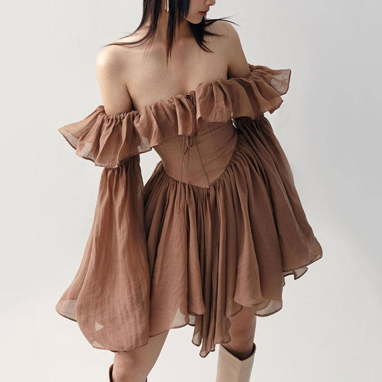 Mocha brown FJØRNA mini dress with a fitted silhouette, styled with streetwear and Y2K-inspired fashion details.