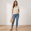 FJØRNA women's summer blouse with short sleeves, lightweight knit top modeled on a woman, casual and breezy summer fashion.