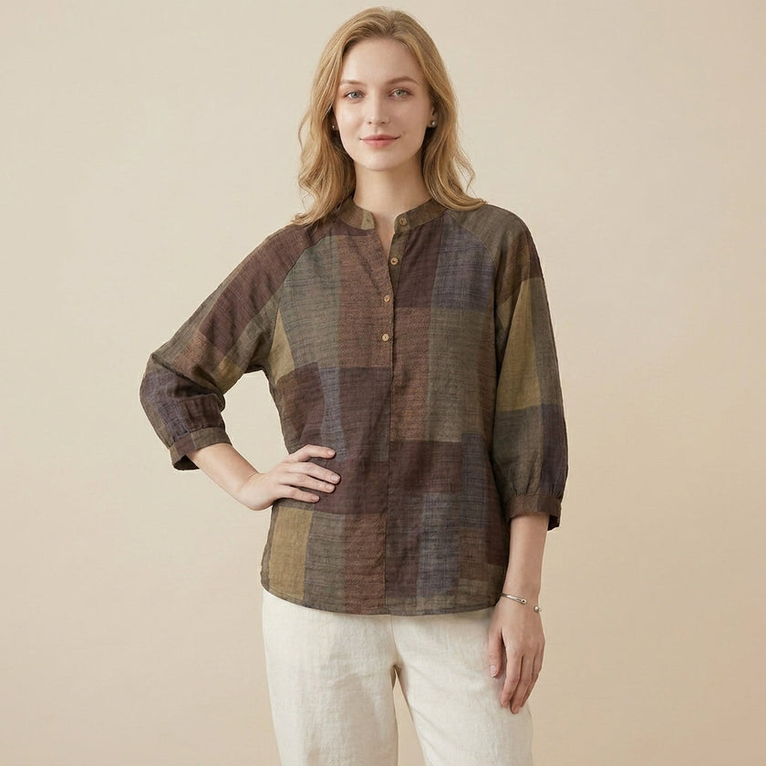 FJØRNA women's summer blouse with geometric pattern and V-neck, worn by a model showcasing casual stylish top.