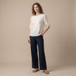 FJØRNA women's floral V-neck summer top modeled on a woman, lightweight and stylish for warm weather.