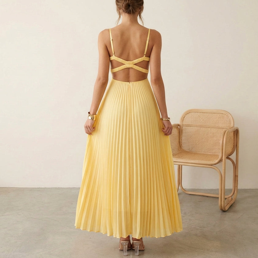FJØRNA Eileen satin ruched bodice sleeveless maxi dress with pleated skirt, worn by model showcasing elegant evening style
