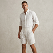 Model wearing men's casual drawstring shorts with side pockets by FJØRNA, showcasing comfortable men's pants for everyday wear.