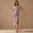 FJØRNA off-shoulder ruched knit midi dress with high slit, styled on a model showcasing elegant design and fitted silhouette.