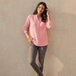 FJØRNA textured button-front blouse for women with chest pockets and relaxed fit, worn by a model showcasing the top.