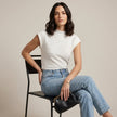 FJØRNA summer women's high neck cap sleeve top worn by a model, lightweight and stylish for warm weather fashion.