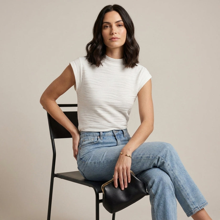 FJØRNA summer women's high neck cap sleeve top worn by a model, lightweight and stylish for warm weather fashion.