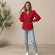 Women’s V-neck pullover blouse by FJØRNA with lace trim and pintuck texture, modeled on a woman wearing the stylish top.