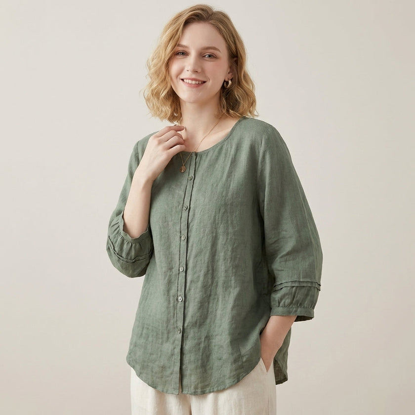 FJØRNA women's linen summer top with button front, casual style, worn by a model in a bright, lightweight design.