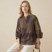 FJØRNA women's summer blouse with geometric pattern and V-neck, model wearing lightweight top suitable for warm weather.