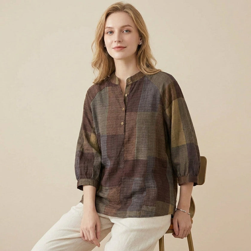 FJØRNA women's summer blouse with geometric pattern and V-neck, model wearing lightweight top suitable for warm weather.