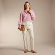 FJØRNA women's summer blouse with striped cotton fabric, worn by a model, stylish and lightweight top for warm weather.